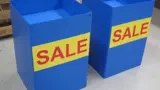 Display bins in blue with printed sale panels
