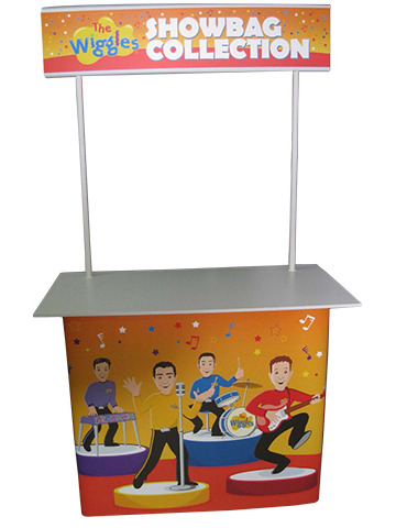Wiggles Showbag Collection counter with a raised header and band artwork on the front