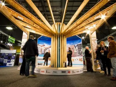 Engineered timber beams fanning out from a central column on the NZWood and iBuilt stand