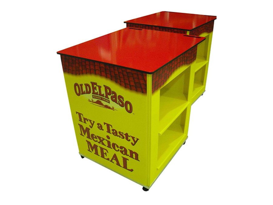 Two Old El Paso sampling carts on castors with glossy red tops, yellow printed sides and open side shelves for stock