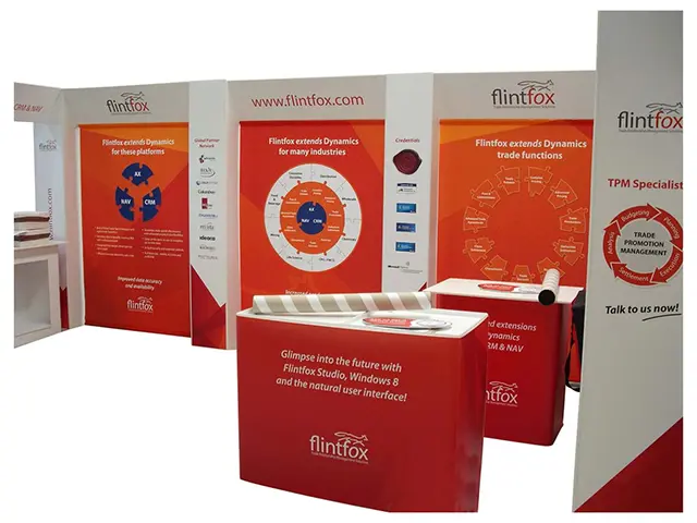 Flintfox stand with printed software graphics on the walls and two portable wrapped counters