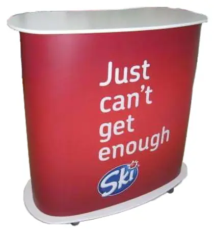 Red Ski counter on castors with a white top and 'Just can't get enough' wrap