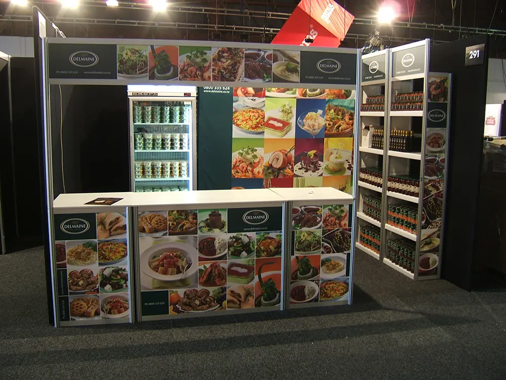 Compact Delmaine stand with food photography, a glass-door fridge and a tall sauce shelving tower