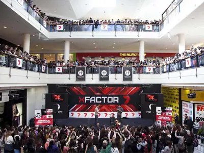 X Factor stage in the Highpoint shopping centre atrium with balconies on several levels