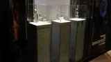 Watch display cases on glitter-finish plinths in a window