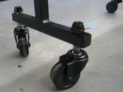 Steel Screenflex divider foot with a swivel castor and coil spring at each end