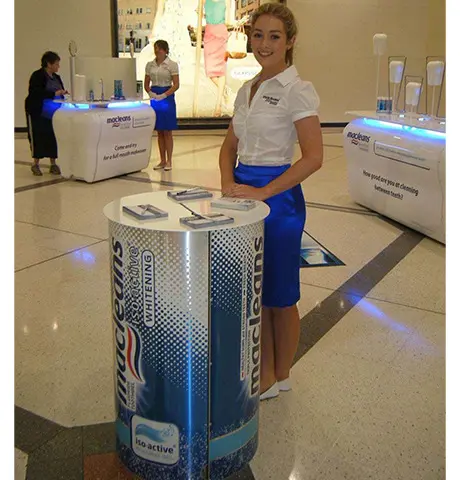 Cylindrical Macleans Iso-Active Whitening counter with a metallic finish and leaflets on top