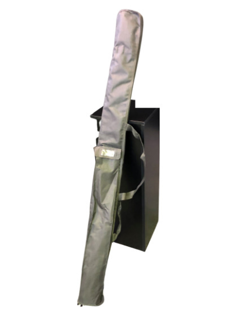 Long grey flag carry bag with a shoulder strap, leaning against a black box