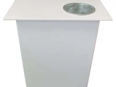 Plain white demo table with a metal bucket set into its top