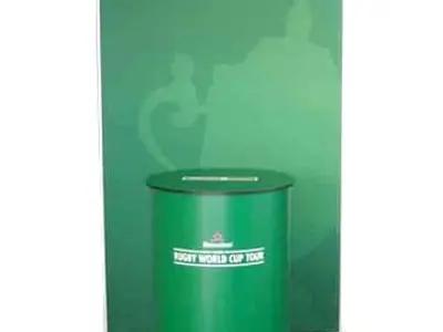 Green Heineken Rugby World Cup Tour backdrop behind a round branded lectern