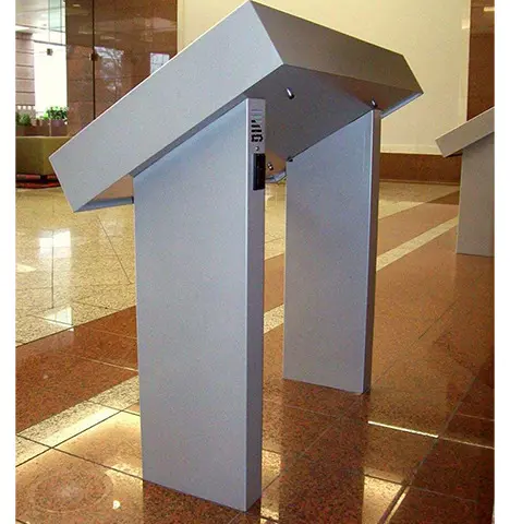 Silver-grey lectern with a sharply angled top on twin uprights in a corporate lobby