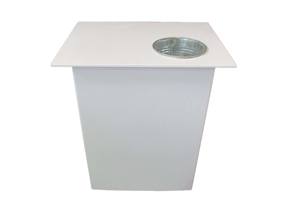 Plain white demonstration table with a round metal well set into one corner of the top