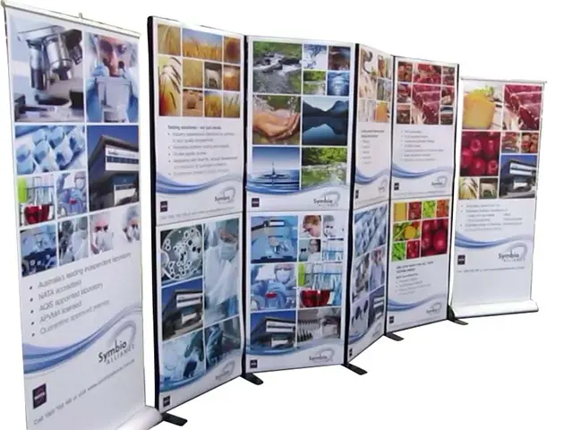 Symbio Alliance framed panels with lab and fresh produce images between two pull-up banners