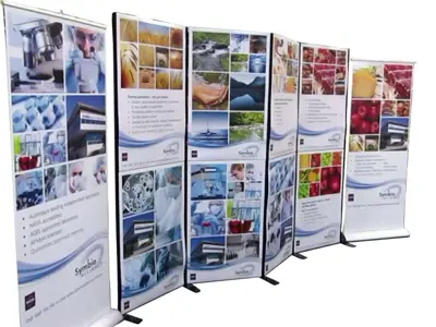 Symbio Alliance framed panels with lab and fresh produce images between two pull-up banners