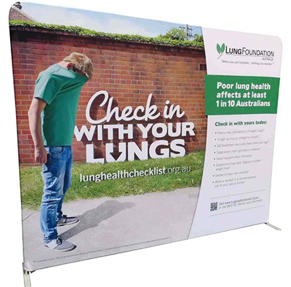 Free-standing fabric display wall on low feet, with a photo of a man by a brick wall running to the top, bottom and left edges, and the headline, logo and text kept well inside them