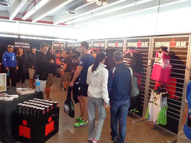 Official IRONMAN pop-up store with clothing on slatwall panels and branded tables in front
