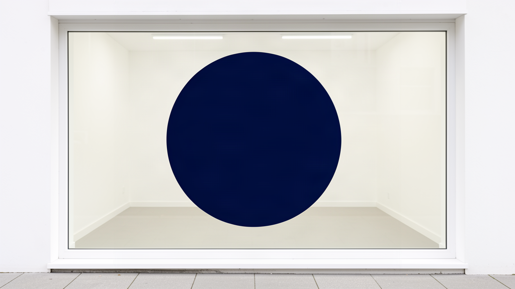 Window decal fully applied to a shop window with no bubbles