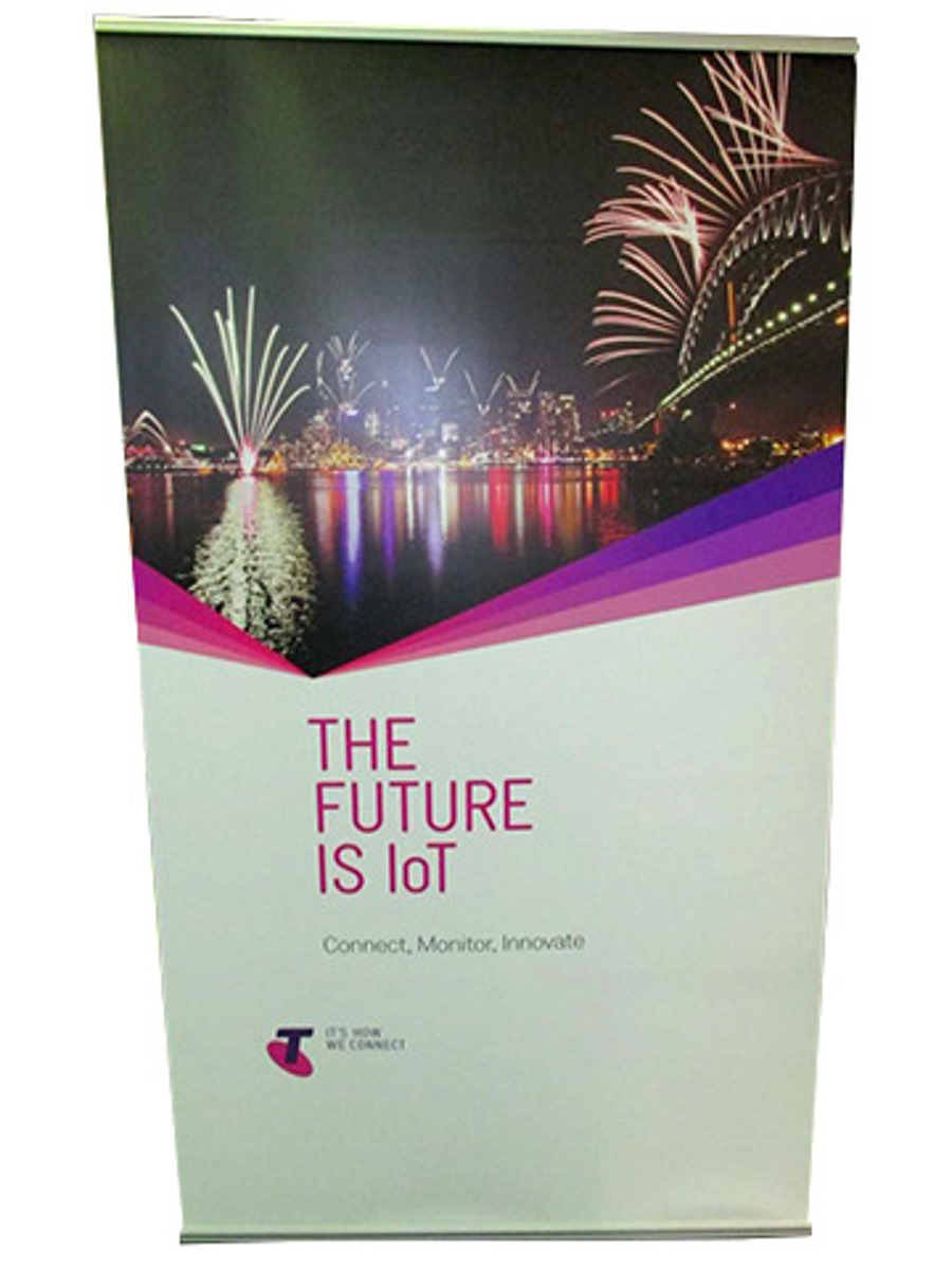 Pull-up banner printed with a Sydney Harbour fireworks photo, a magenta colour sweep and the line "The Future is IoT"