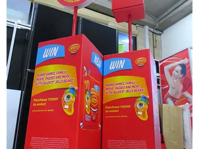 Red Allen's competition bins on castors with jelly bean packs and round header signs