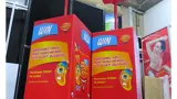 Dump bin display on castors with round header signs