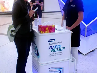 Two stacked Sensodyne Rapid Relief modules holding tissues and samples above a blue-lit base