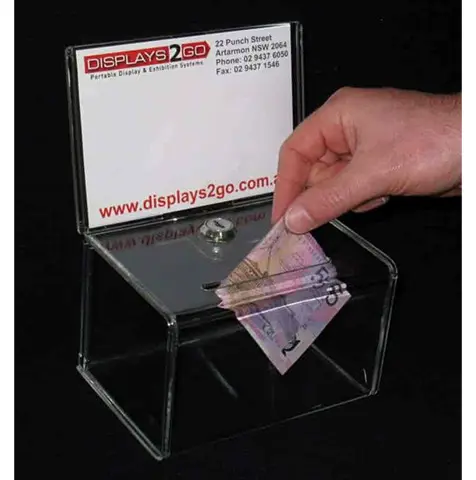 Banknote posted into a small perspex box with a key lock and upright sign holder