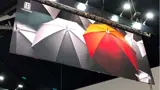 Hanging sign above a stand at an exhibition