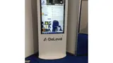 Digital advertising screen tucked into a stand corner