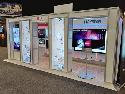 LG and Ingram Micro booth with tall bird-and-flower screens set in a white frame