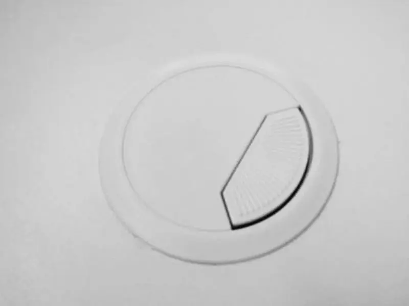 Cable entry cap fitted into a counter top