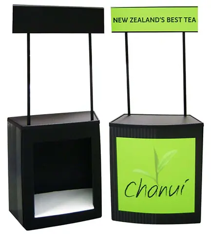 Chanui tea demo counter seen from the green branded front and the open storage rear