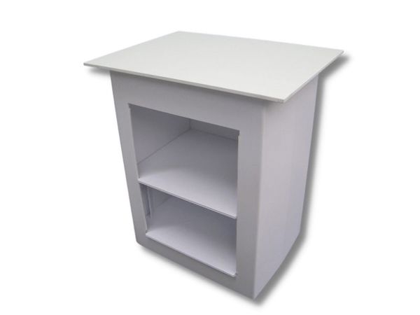Rear view of a white demonstration table with an open back and two internal shelves for stock