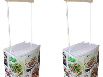 Matching pair of Coles demo tables with food photo fronts and white worktops