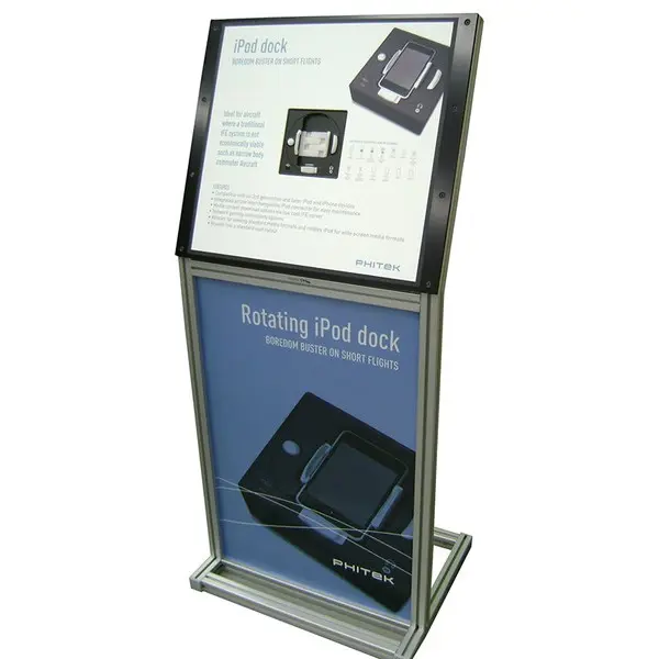 Phitek aluminium stand with an angled top panel above a poster of an iPod dock