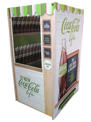 Coca-Cola Life vending display with a bottle-filled window under a green and white scalloped awning