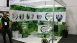 Shell scheme corner stand with leaf-print wall graphics