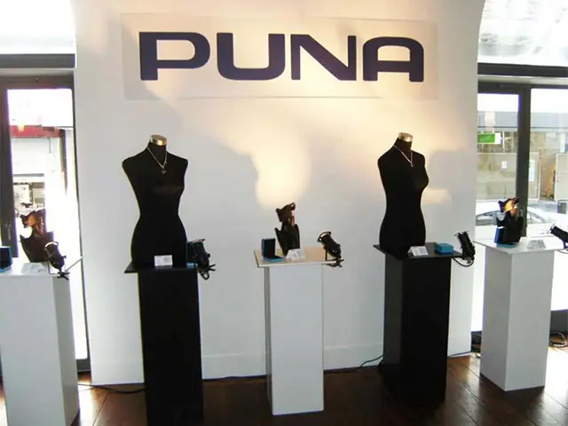 PUNA showroom with mannequin busts on black plinths and smaller jewellery pieces on white plinths