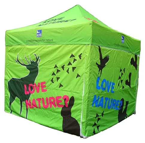 RSPB marquee wrapped in bright green Love Nature artwork with wildlife silhouettes on every wall