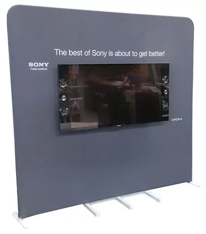 Grey fabric Sony Xperia wall with a built-in TV screen and speakers on slim feet