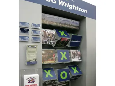 PGG Wrightson brochure panel under a blue header with card holders and angled rural photos