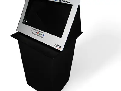 Black bl!nk photo sharing kiosk with email, mobile and Facebook options above the screen