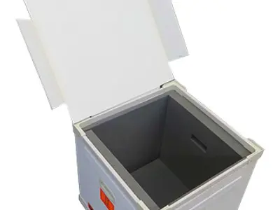 Open white road case lined with thick grey foam, with hand holds and Fragile labels