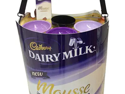 Promoter wearing a Cadbury Dairy Milk Mousse tray on a shoulder strap, with sample bowls