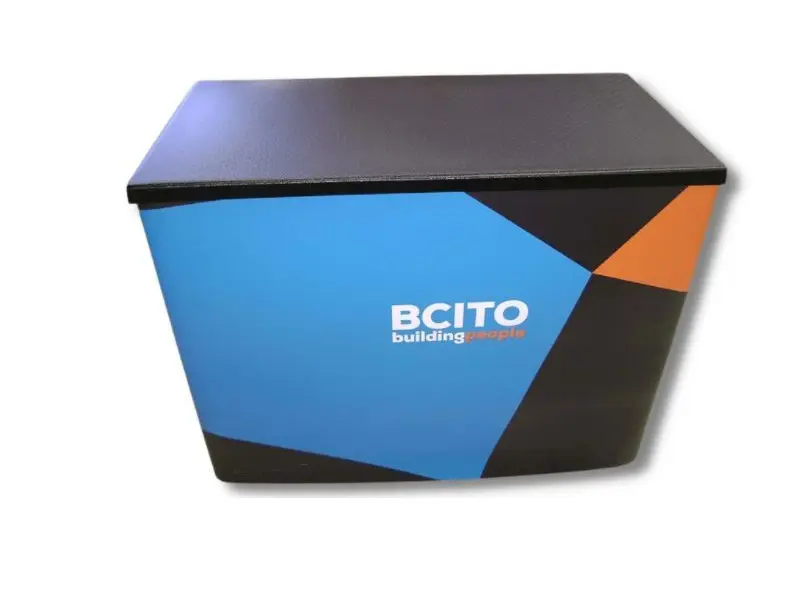 Superlight 1200 demonstration table with branded wrap and black top