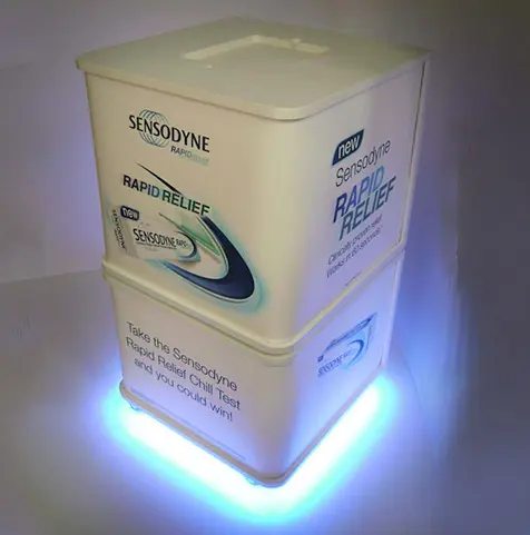 Sensodyne Rapid Relief cube wrapped in pack graphics, with blue lights around its base