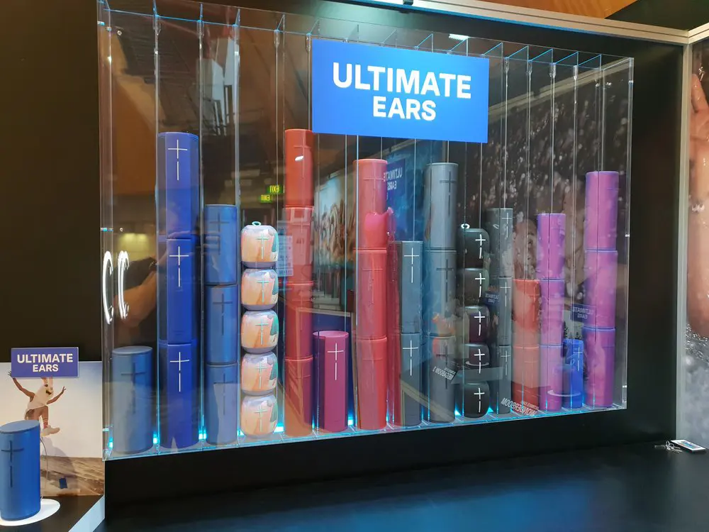 Ultimate Ears speakers stacked in colour columns like equaliser bars inside an acrylic case