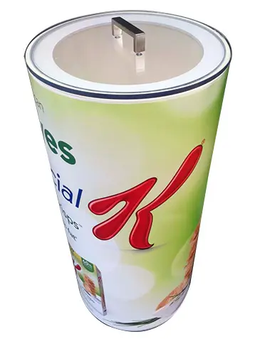 Special K cylinder sampling bin with a red K wrap and a clear handled lid