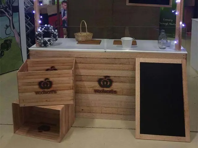Slatted timber Woolworths tasting counter with matching crates, a chalkboard and fairy lights