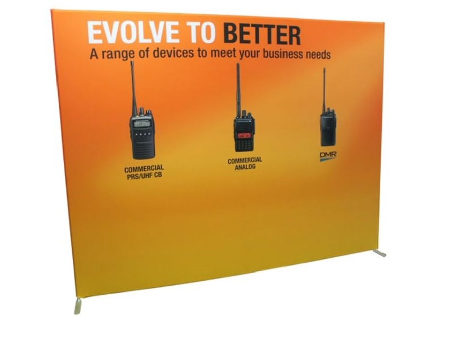 Straight 3 m fabric backdrop wall with an orange printed graphic showing a headline and three handheld two-way radios