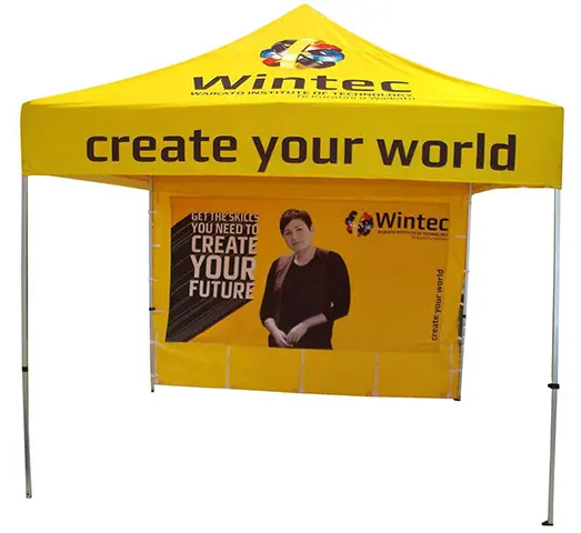 Bright yellow Wintec gazebo with a student portrait printed on the back wall